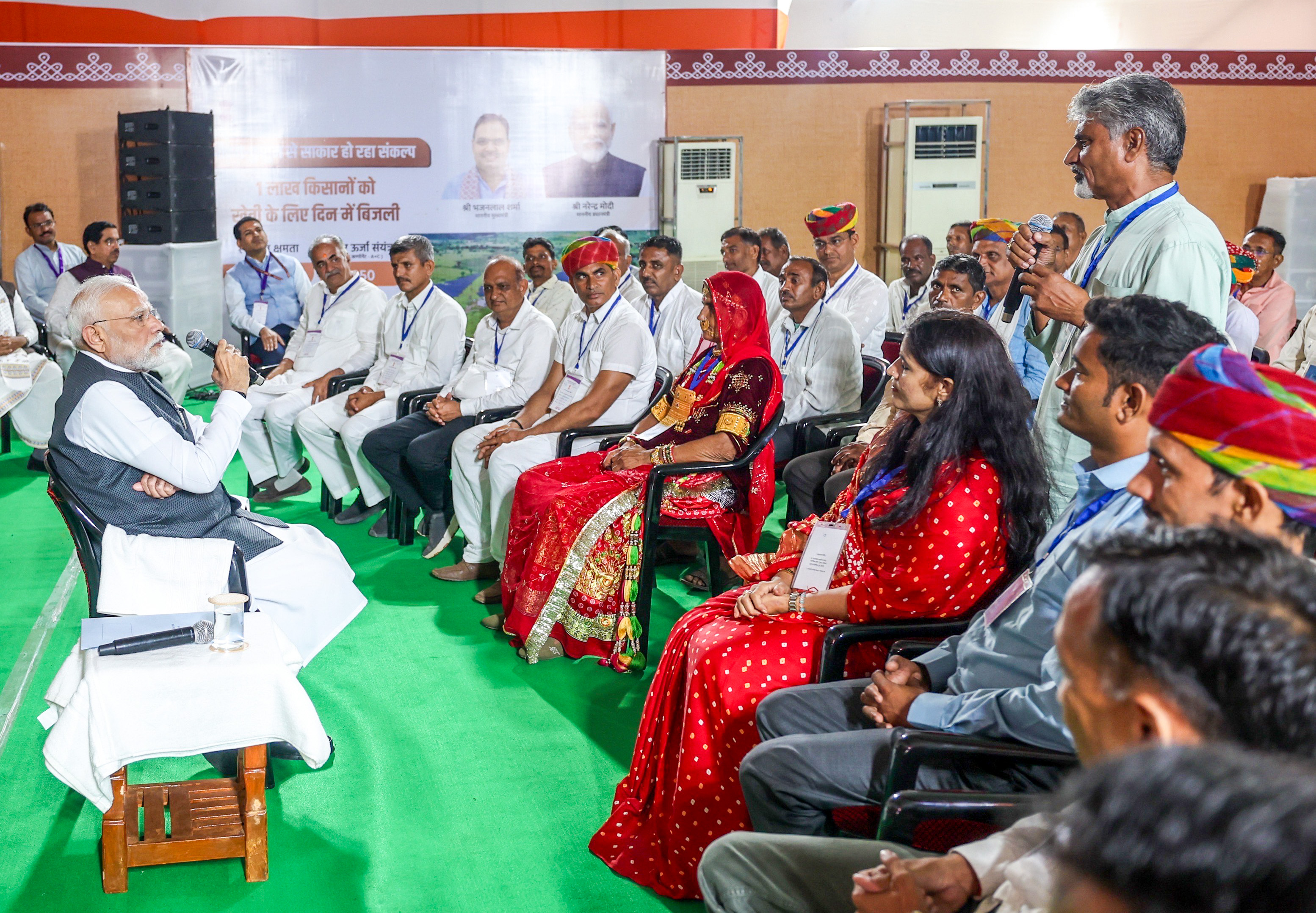 PM-KISAN scheme disbursement event with farmers receiving financial assistance
