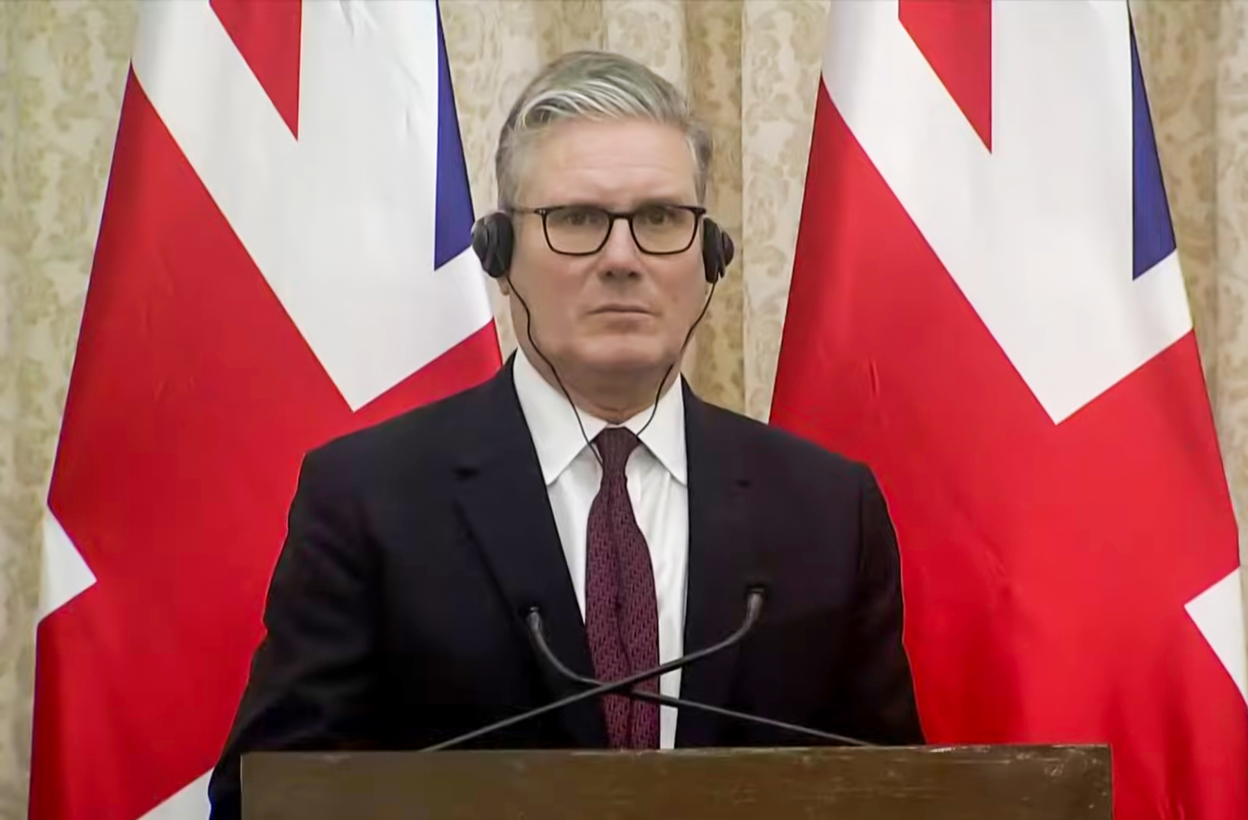 UK Prime Minister Keir Starmer looking serious during a press conference