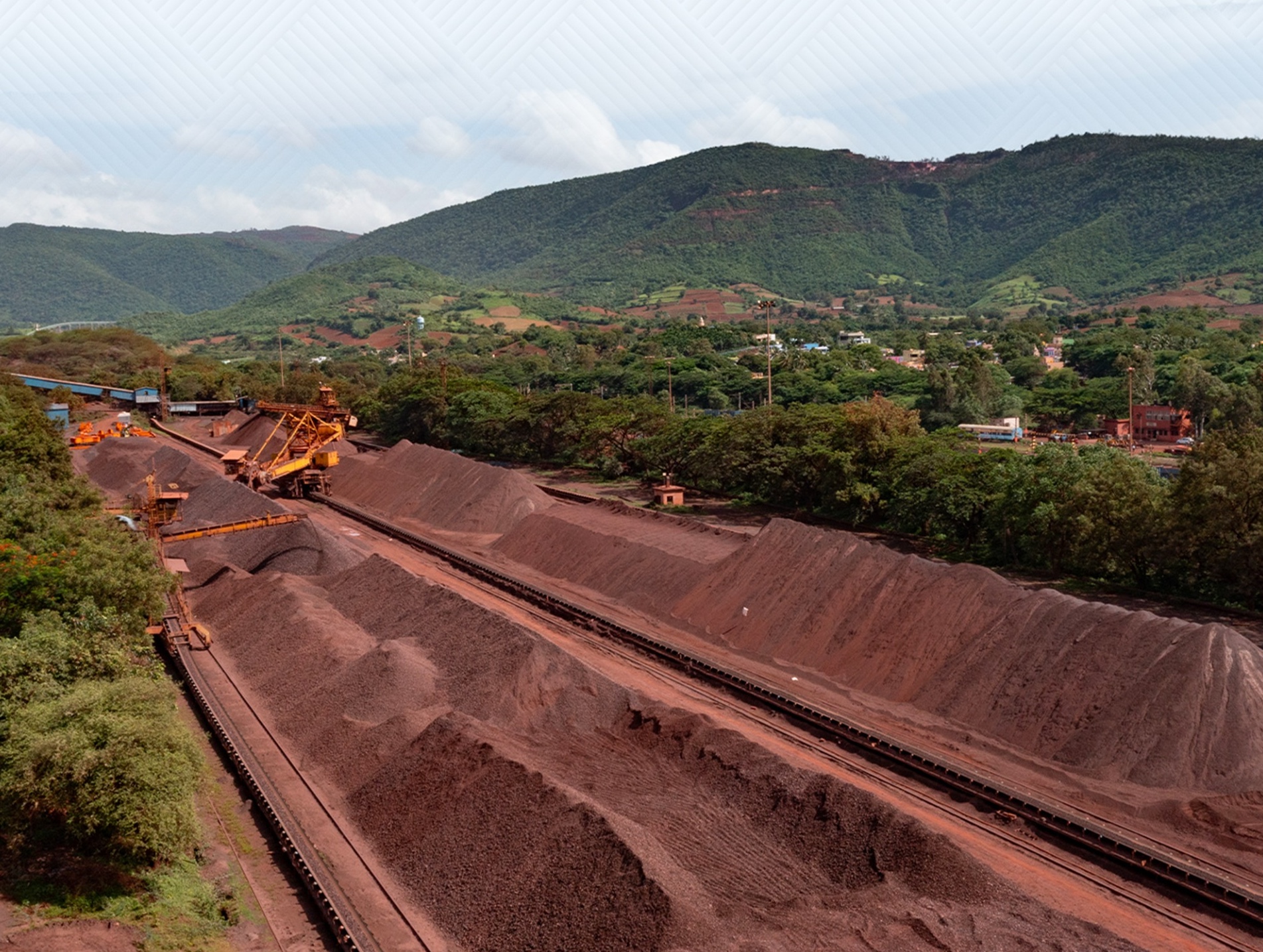 NMDC iron ore mining site showing heavy machinery and operations