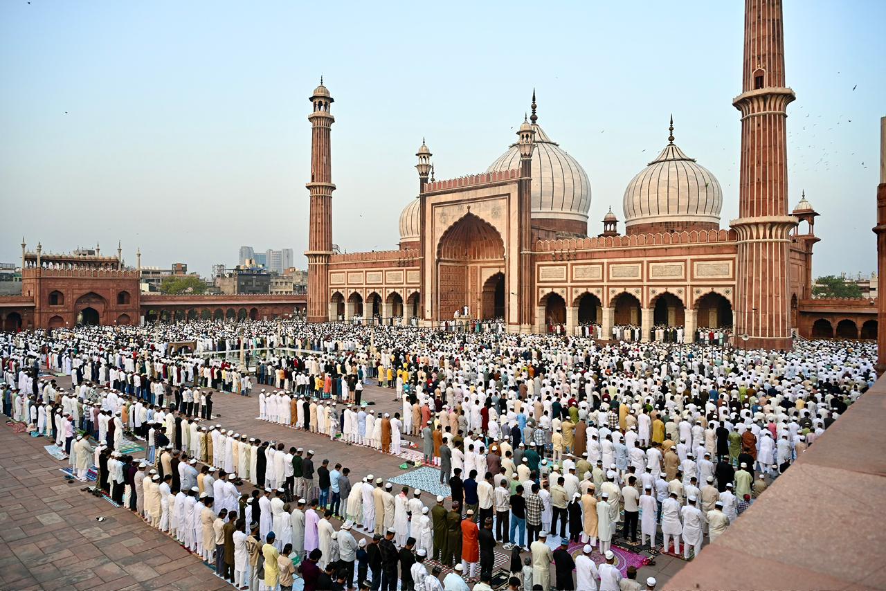 Eid al-Adha prayers at a mosque with devotees in traditional attire