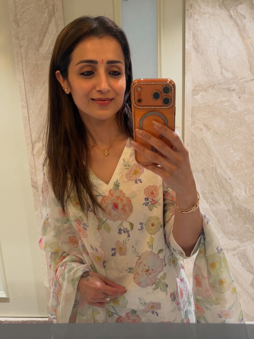 Trisha smiles in a selfie with her dog during her Magical May