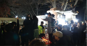 S.Korea: Citizens outside Nat'l Assembly applaud as bill to lift martial law passes